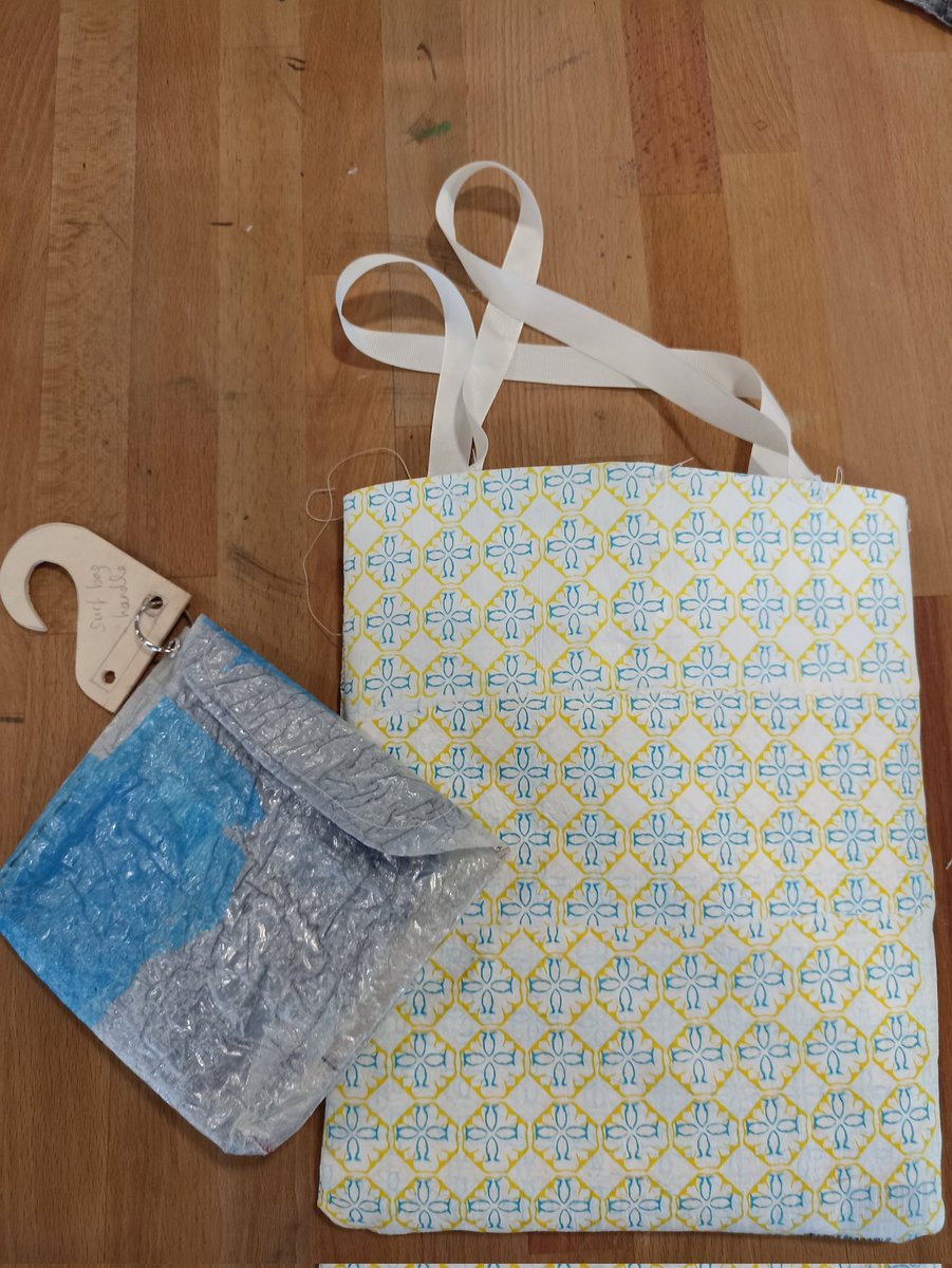 StJuliansDesign's tweet photo. Making sustainable long lasting bags/clutches/wallets out of single use plastic bags fused together. One student creatively used an old book cover for the base of her bag. #sustainability https://t.co/UsfzmZ8isl