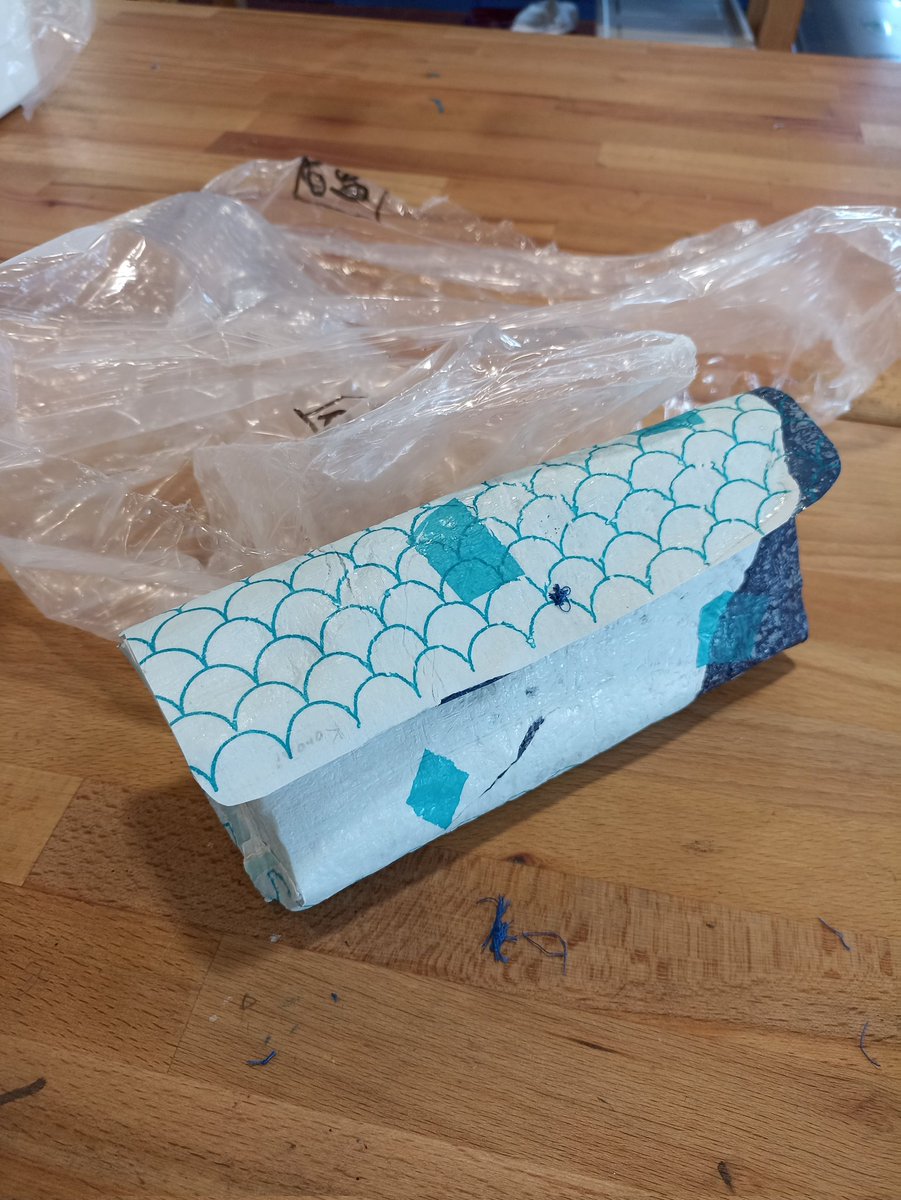 StJuliansDesign's tweet photo. Making sustainable long lasting bags/clutches/wallets out of single use plastic bags fused together. One student creatively used an old book cover for the base of her bag. #sustainability https://t.co/UsfzmZ8isl
