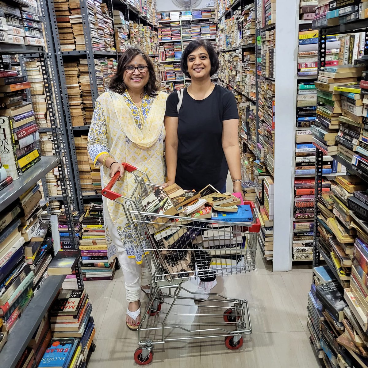 SudeshnaShome's tweet photo. The librarians of @NookCosy Cosy Nook Library are two very happy women today. Here is our book haul at @blossombookhous. Picture taken by a friendly book shopper we met in the aisles and who chatted away merrily about out of control book collections. https://t.co/iIDSvt2Y89