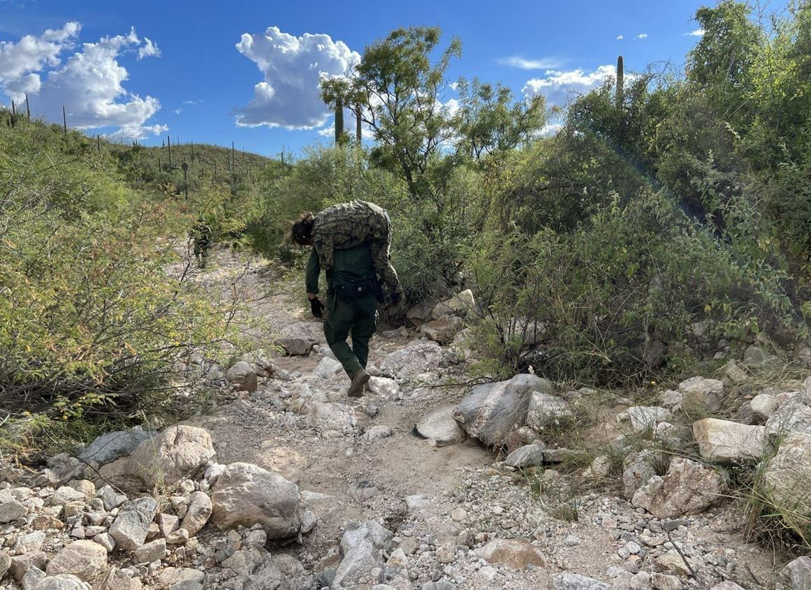 USBPChiefTCA's tweet photo. On October 8th, Tucson Sector agents responded to a 911 call in the Baboquivari Mountains. Agents provided first-aid to the injured migrant then carried her for over three hours to an awaiting ambulance. This was one of 42 rescues made by Tucson Sector agents since October 1st. https://t.co/p1ldG7POzF