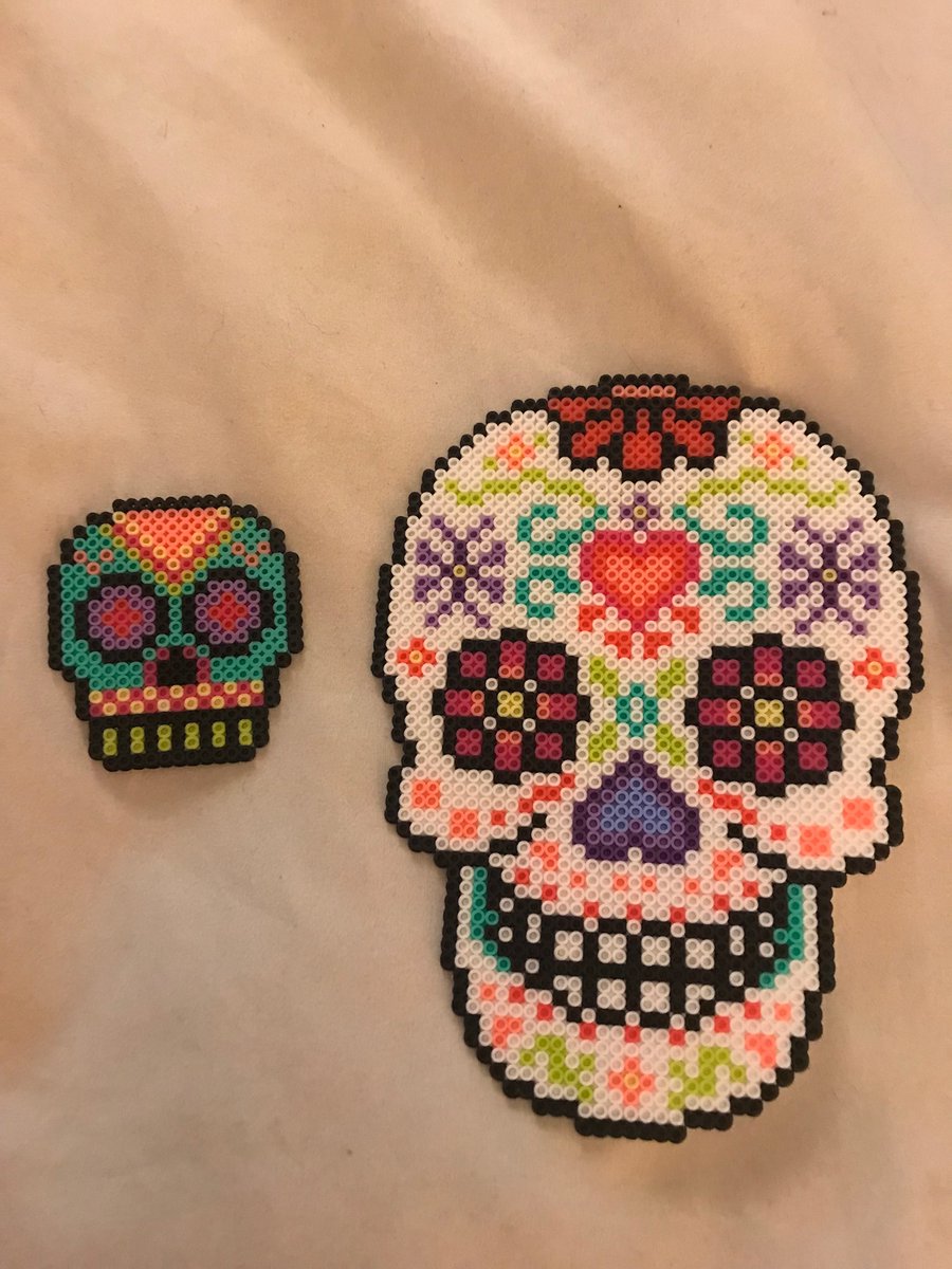 LouLouCheecher's tweet photo. Working on Skulls this week! Patterns found on Pinterest and I just made my own designs and chose my own colors #pixelart #pixelated #perler #hama #artkal #fusebeads #meltybeads #kandi #kandipatterns #8bitart https://t.co/cWqrZidhMX