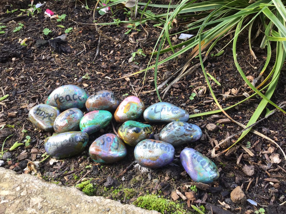 Woodland_Grange's tweet photo. The children from Mindfulness and Well-being club decorated pebbles this week to add to our new school flowerbed. If any children would like to make some to add after half term please do! Don’t forget to include a positive word to share with others too ❤️ https://t.co/hRYvjrc69E