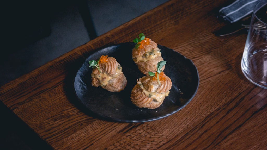 A new snack on the menu - Smoked egg choux with trout roe.

As our pastry chef noted - 'It's just a posh egg sandwich init?'

Choux buns filled with a smoked egg salad with capers, shallots and herbs. Topped off with trout roe and basil. 

smokeandsalt.com