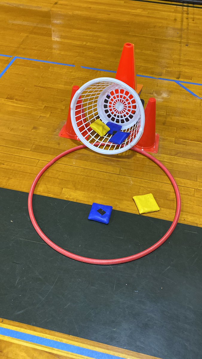 YESPEDorman's tweet photo. Students are working on underhand toss. Similar to cornhole, if you make it in the hoop 1 point, 3 points if you make it in the basket (cones used to support basket) https://t.co/NZ4pPDWwTL