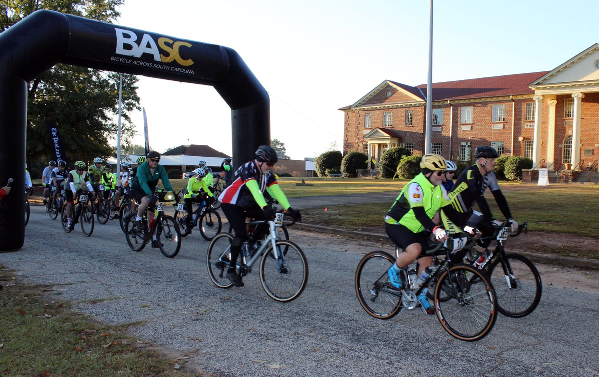 JDLHSchool's tweet photo. The first morning ride of the epic Bicycle Across South Carolina event is underway. The route begins and ends in front of historic De La Howe Hall, with hundreds of cyclists from across America visiting the campus for the weekend. #BASC2022 #bicycleacrosssc https://t.co/FyXSa1yaDT