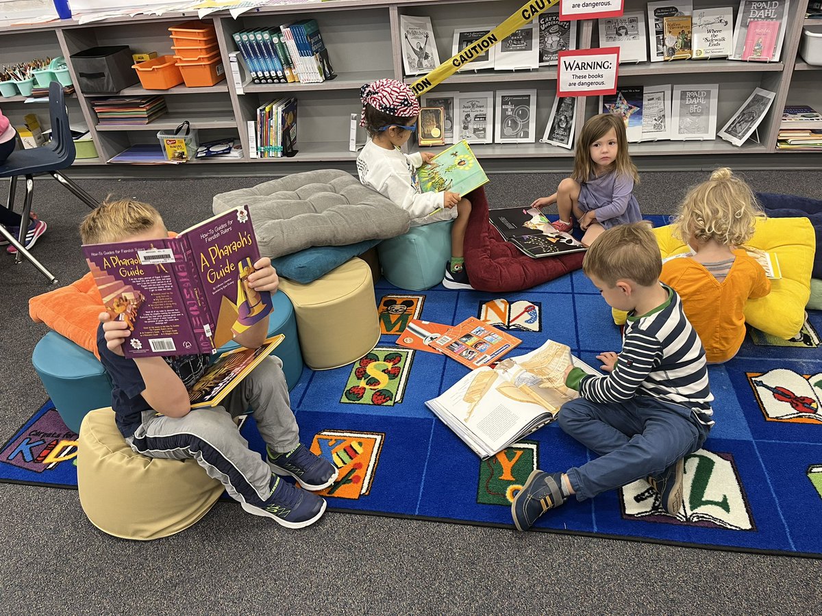 MPSA_Library's tweet photo. When walking past our library you might hear primary students singing the Parts of a Book song, and when peeking in, you’ll see them reading in our cozy book nook. @MPSArlington @APSLibrarians https://t.co/HmYe5xCKN6
