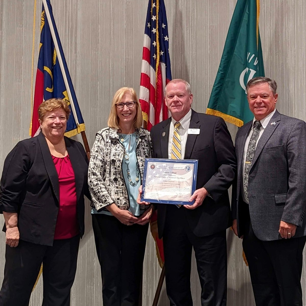 Gaston_College's tweet photo. In honor of National Cybersecurity Awareness Month we’re throwing it back to a few weeks ago when Dr. Hauser and Dr. Albright-Jurs received our official Center of Academic Excellence Designation from the NSA for our Cyber Defense program. #FlashbackFriday https://t.co/WlR8oXFDkr
