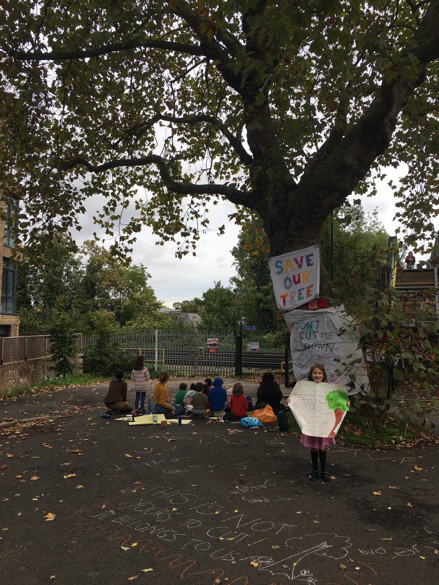 JV7025's tweet photo. Local children celebrated the Sydenham Park Plane Tree today. They understand the importance of our majestic tree, which benefits both the physical and mental wellbeing of all our community. Thanks to Macey for the beautiful poster ❤️🌳 Photos shared with permission. https://t.co/0qP2S9jtiV