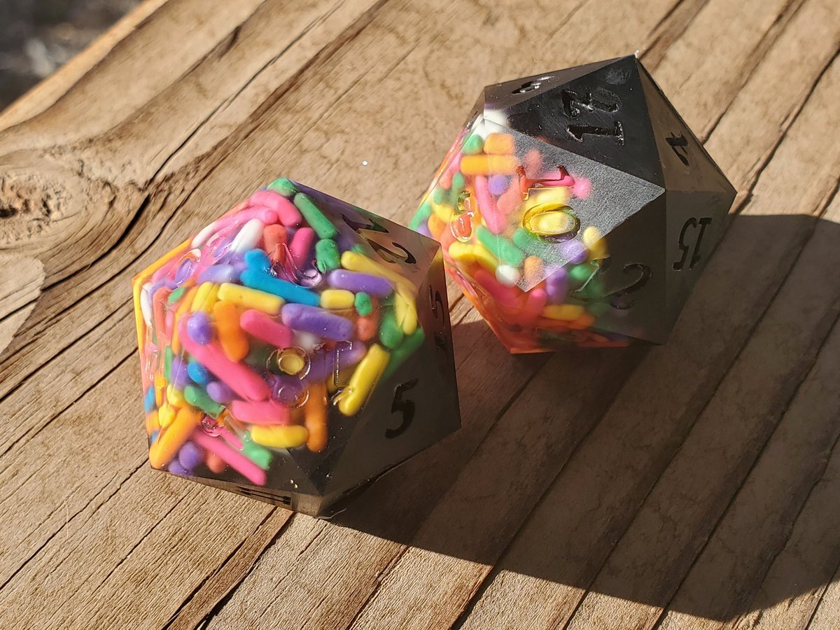 GeekMeUp_Scotty's tweet photo. Sprinkles dice version 2, with two matching chonks. These were a lot of fun to make.
#dnd #dice #rpgdice #ttrpg #resin #resincasting #handmadedice #diceaddict #dicegoblin #dicemaker #sprinkles #chonk #largeD20 https://t.co/C71vxpRmn8