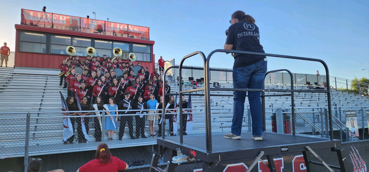ThePicture_Lady's tweet photo. On the field early for Friday night selfie…. Picture Lady does ALL sports! #LHS Band is very close to my heart… with my oldest in the Army Jazz band after four years at Liberty High School with band followed by ASU band… @LHSAthletics22 https://t.co/NmZUFw4Qln