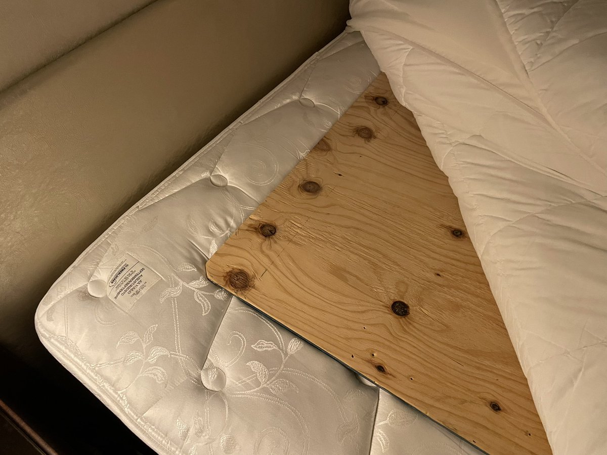 baywater's tweet photo. @HiltonHotels Completely unacceptable!  Checked into hotel in San Francisco and found this under my sheet!  Hit my head and back on it as I fell backwards on bed to lay down. 3/4” plywood under the sheet?  Entire staff in complete shock and didn’t have any clues. https://t.co/aMcZRWngYd