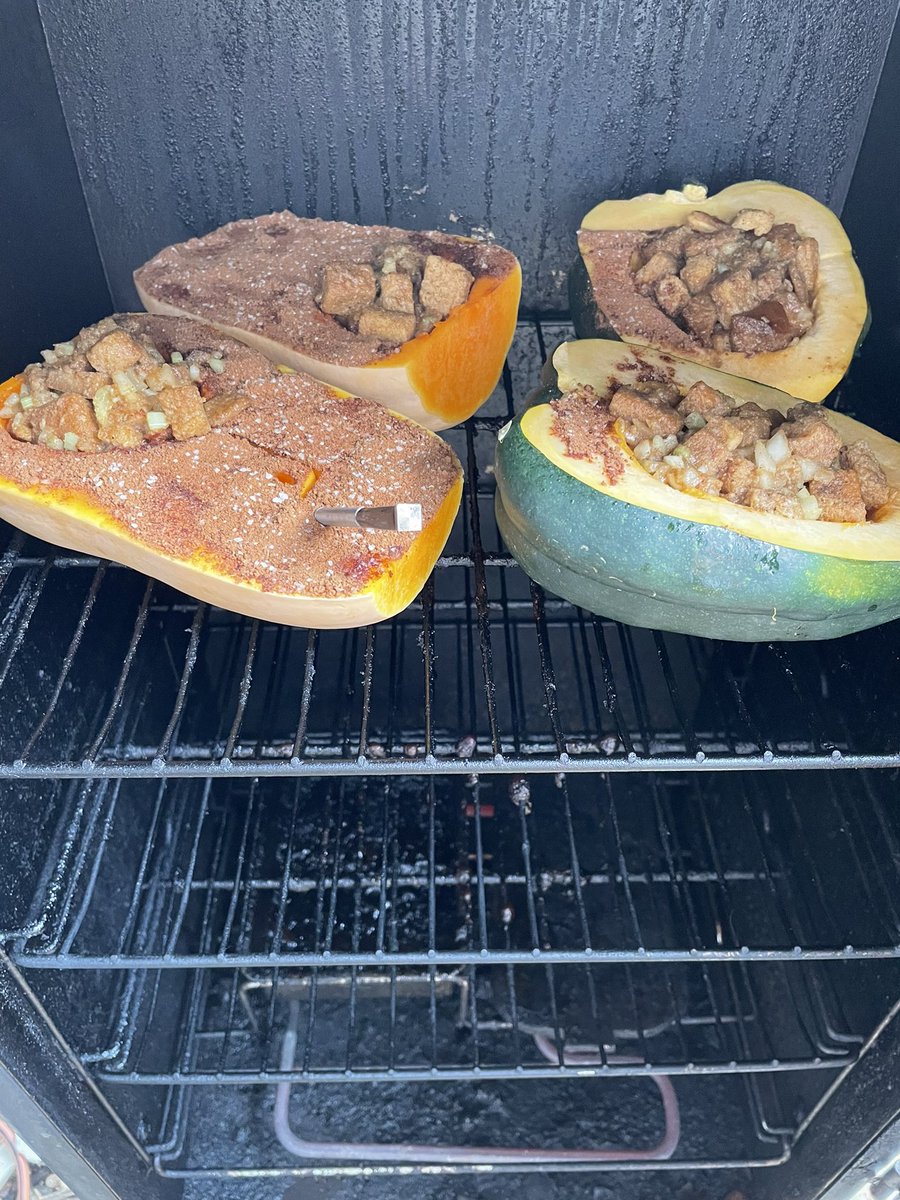 DrUsual's tweet photo. Butternut squash and acorn squash, filled with stuffing and I’m the smoker for a few hours. https://t.co/xQgEwtXUAh