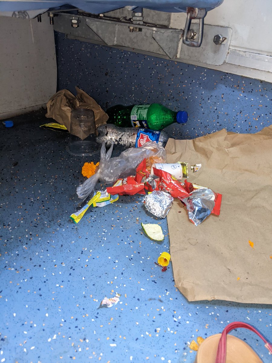 crkulgod's tweet photo. @RailMinIndia @RailwaySeva Traveling from Train No 16507 from BDQ to SLI. I just boarded the train from Vadodara and found this trash below my seat No 21 and 22 in Coach A2. Is this why we pay a great amount of money? this is unacceptable. https://t.co/At6iY7GY0y