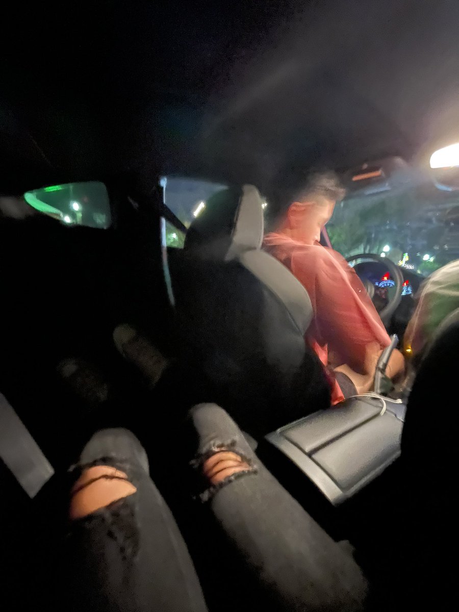 me in the back of my brother’s tiny  speed racer getting a free ride home