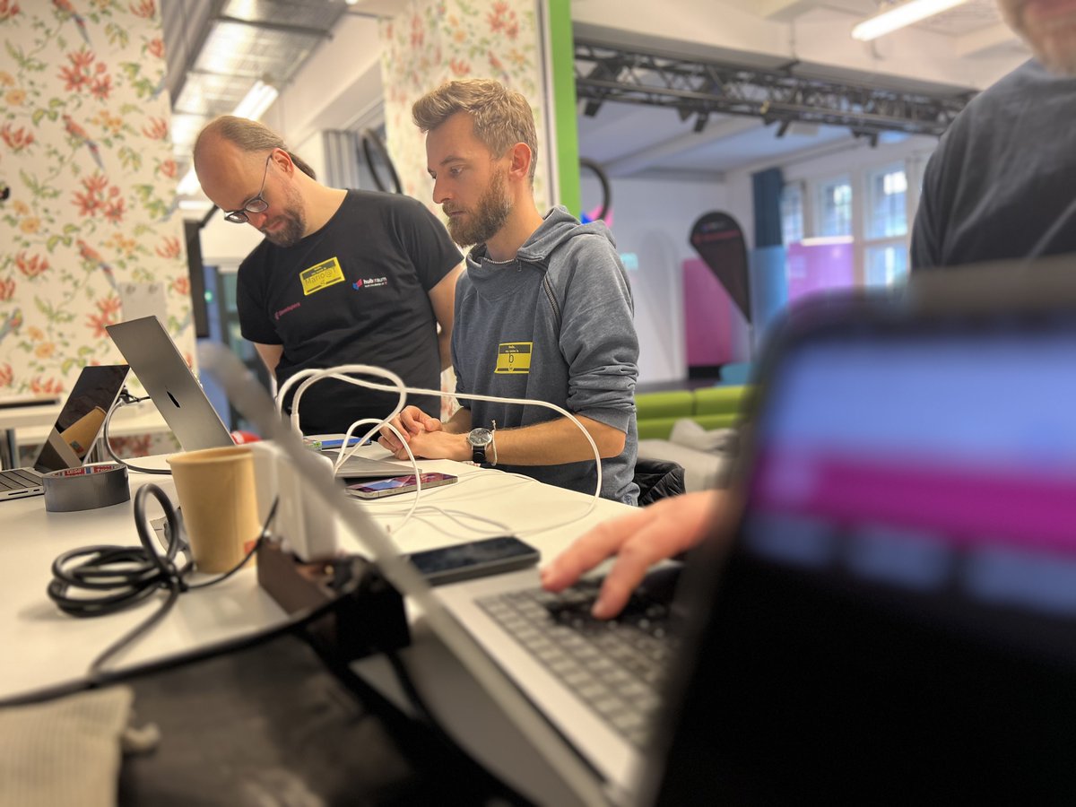 s_schumann's tweet photo. At #TADHack #Berlin @MarioBodemann from @hubraum advises developers how they can prioritize their apps on the @deutschetelekom #5G network. It's exciting to see the possibilities that are enabled w/ #telcoapi. Can't wait to use it soon w/ the #WebRTC stack on our #CPaaS platform https://t.co/85bWeoRDPi