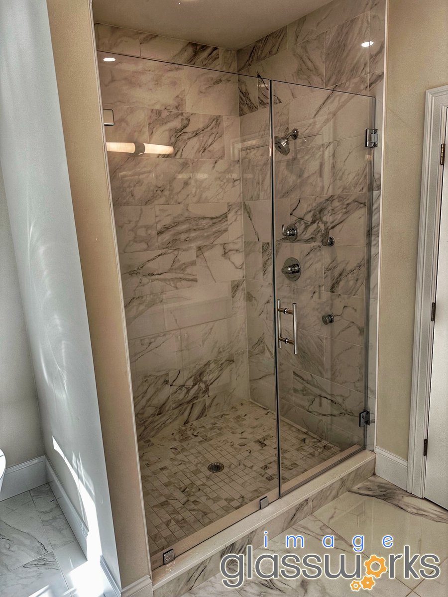 ImageGlassworks's tweet image. A door and panel is one of the cleanest and least expensive ways to configure your frameless shower door, and it looks great!  Seen here is 3/8” low iron glass with chrome hardware and a 6” ladder pull handle. Installed in Melrose.