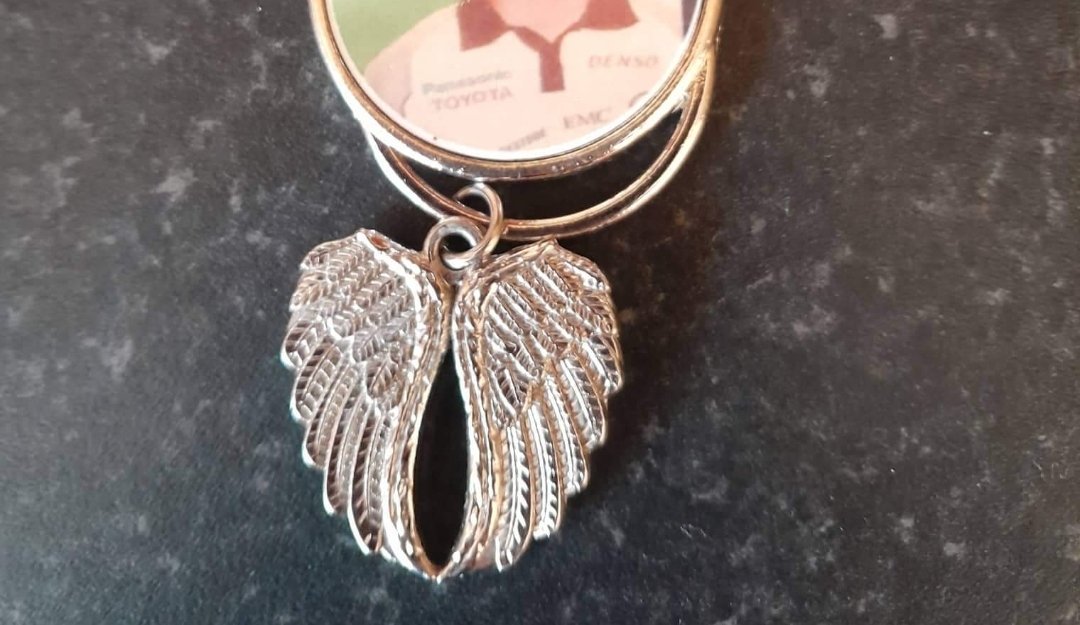 Found  in Glanmire.  This will be precious  to someone. A mans photo with angel wings. Please rt