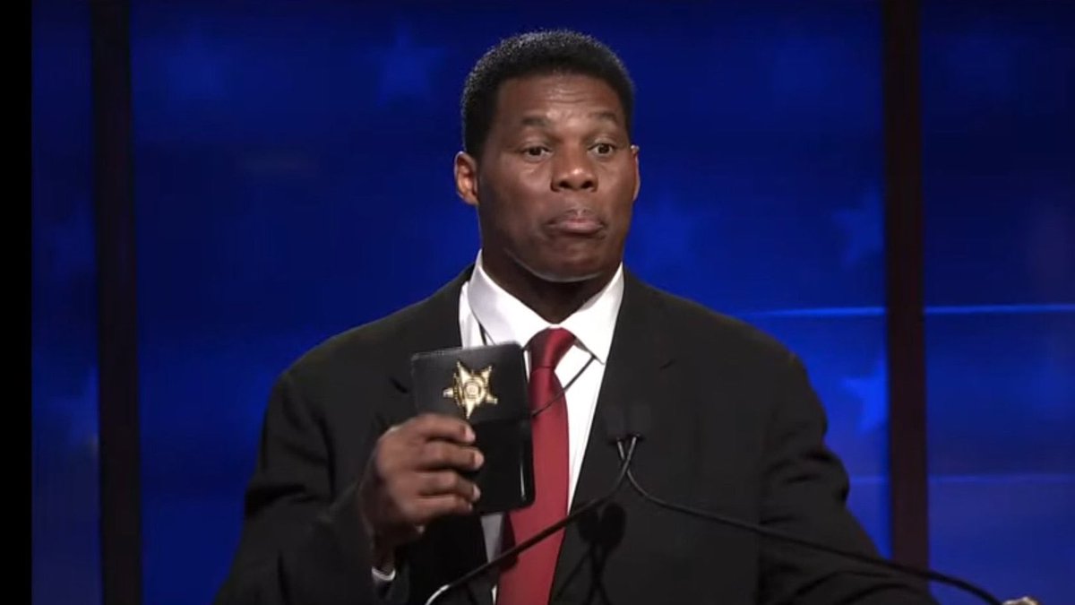 PRO TIP: If fake police officer Herschel Walker pulls you over, try bribing him with Monopoly money.