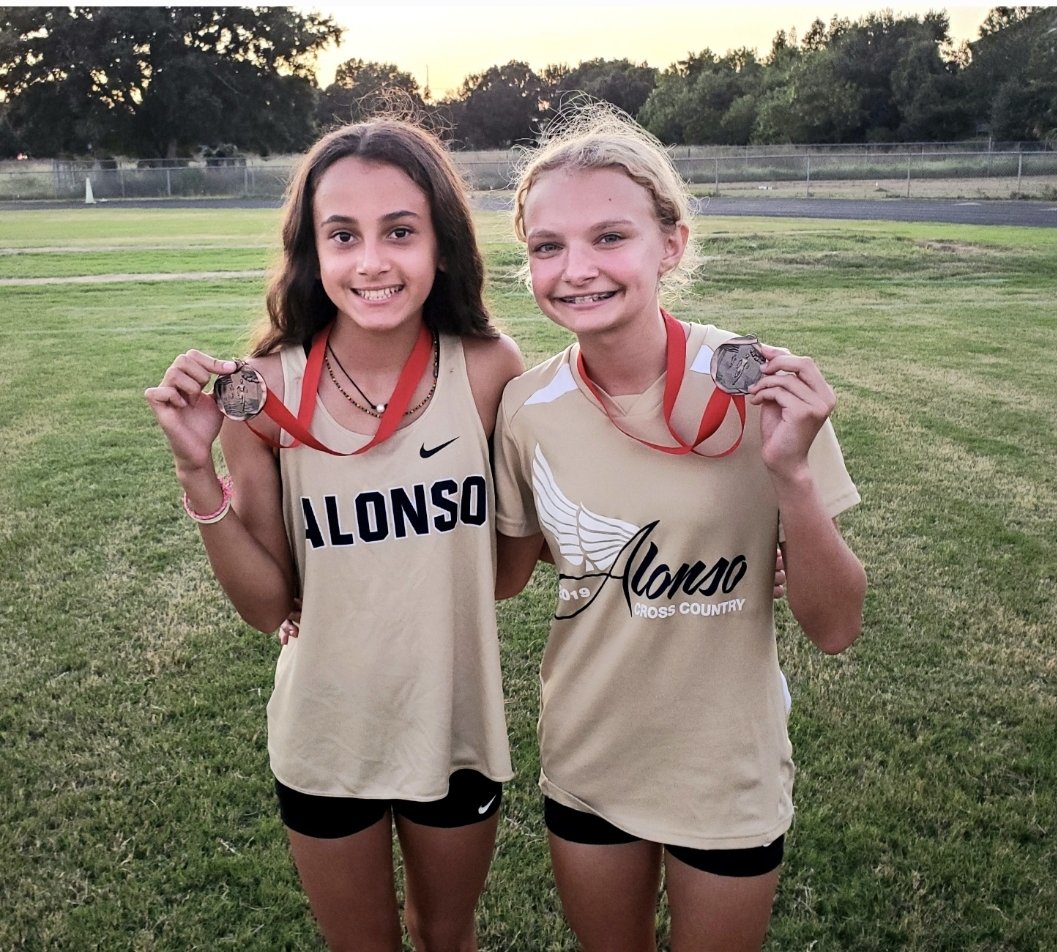 RavensXCTnF's tweet photo. A dynamic duo as freshmen, seniors Nathalia Mallo (left) and Skyler Gillett enter the District/state series beaming with confidence, and carrying our team. We can't thank them enough for their dedication to the program! #PlanetRaven #respectoursport https://t.co/Ui6ItBZRae