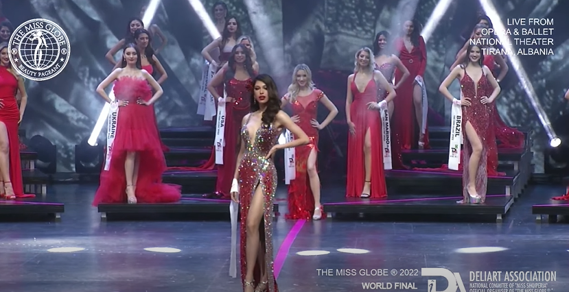 ABSCBNNews's tweet photo. #MissGlobe2022 Philippine bet Chelsea Fernandez stuns in a shimmering silver and red gown at the evening gown portion. https://t.co/lcGlvxn1fv