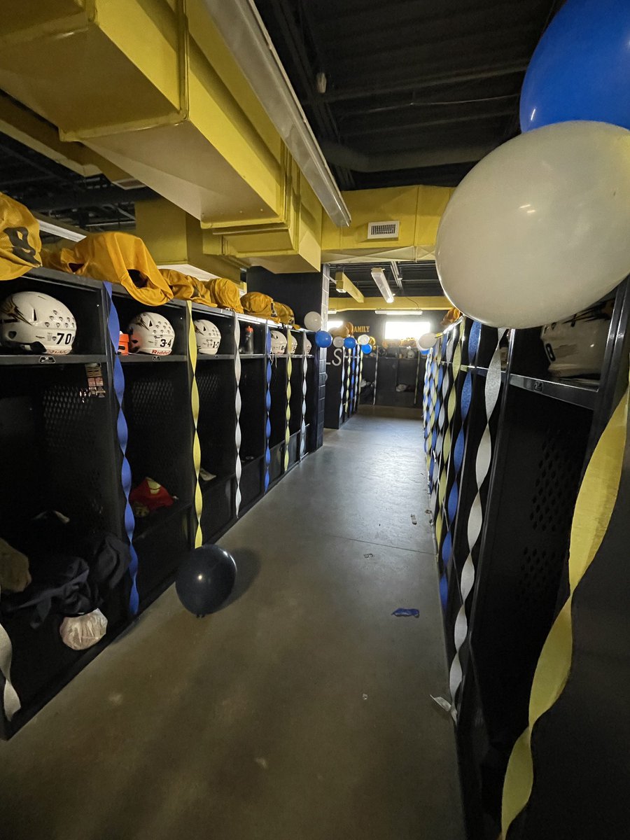 tallmadge_cheer's tweet photo. Then Coach Gray (big shot out 📣!!!) arranged for us to decorate the locker room to surprise the football players for the game! She also organized an awesome balloon arch for all senior athletes to pass through when announced before the football game! 💙💛🤍 https://t.co/BwNLpofqjt