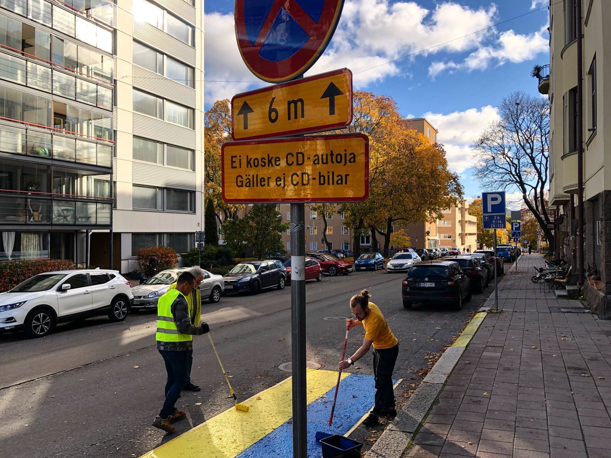 M_WrenchGang's tweet photo. Two Finnish men 'annexed' a Russian diplomat's parking spot in the Finland’s city of Turku, by painting it with the Ukrainian flag.

They called it the result of a "2-man referendum" on "annexing" the spot. The city announced it would not paint over it. https://t.co/1GbWVWCSIV
