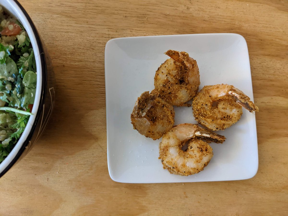 Dinner of 4 crispy fried cornmeal crusted shrimp with a greek salad. -AP