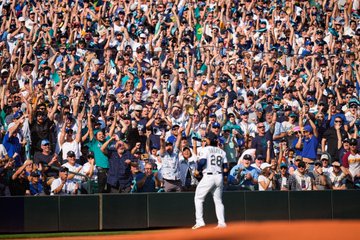 Shot of fans cheering in the stands. 