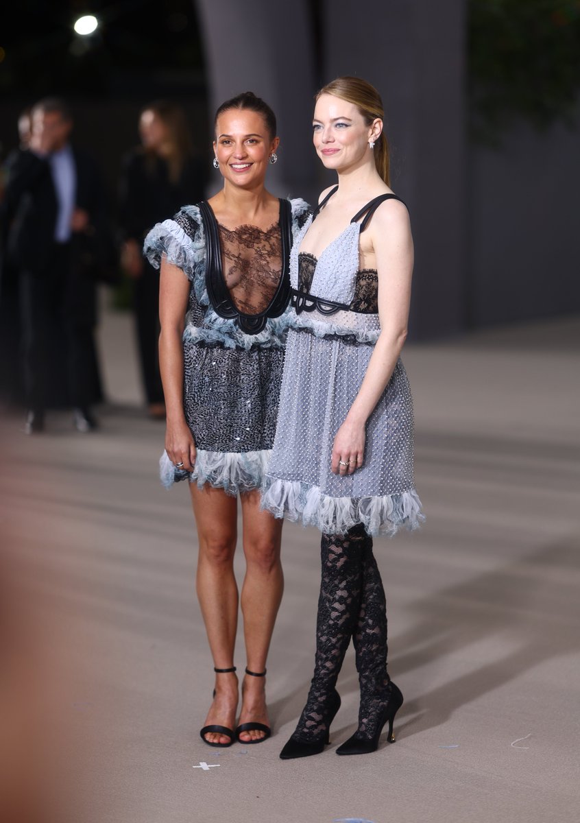 Variety's tweet photo. Alicia Vikander and Emma Stone pose on the carpet at the #AcademyMuseumGala. https://t.co/Kgn1eseW4w https://t.co/RvAa3ZJIDk