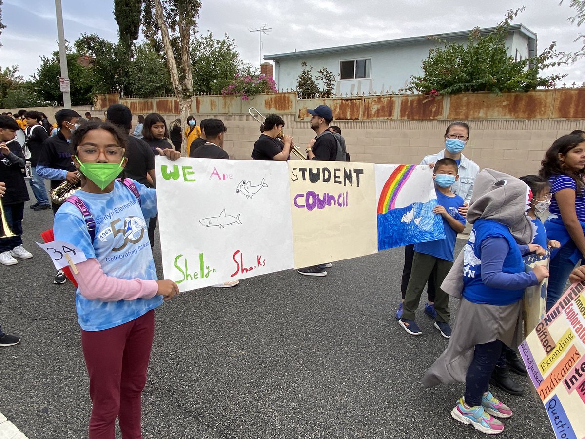 MrsVoong's tweet photo. @shelynsharks community swam together at @buckboarddays parade. Shout out to our wonderful parents and students for making these beautiful posters. @RowlandSchools @choulaoshi https://t.co/se9TC1qDtS