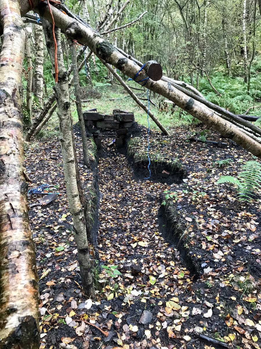 coal_legacies's tweet photo. A mysterious trench has appeared in the spoil at #Carnock #Coke and Chemical Works #Cowie stratigraphy systematically exposed, spoil has been removed from site, the semi circle reveals #bitumen, tools abandoned on site and why the fire pit a roof frame? Any ideas? #coal #waste https://t.co/s1Ge82brNr