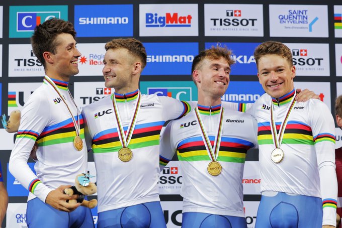 GB's Men's team pursuit share smiles in their rainbow jerseys & gold medals