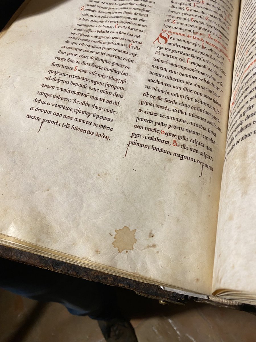 Handling a book written in 1190. I like to think that the stain on the bottom of the page was wine. #rioja #monasterio de yuso