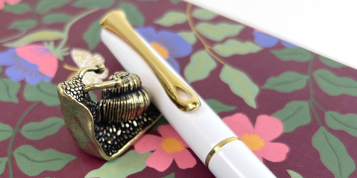 PenChalet's tweet photo. The new Sassy Brassy Snail pen rest is always right where you need it when you want a whimsical spot to rest your pen...because even if he tried to escape, he wouldn't be fast enough. Get yourself your very own:
https://t.co/jCv0Vijsni #penrest #penholder #snailpenrest #penchalet https://t.co/mnfZ1YQoYP