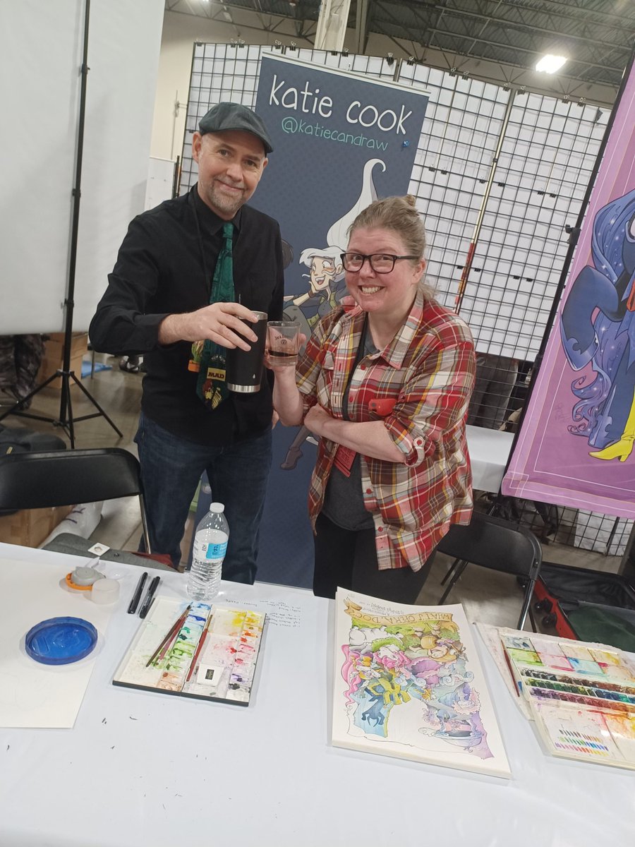 BrianEArts's tweet photo. Always cool when you have a good table neighbor like @katiecandraw! Toasting to success and watching 👀 her work on the next masterpiece #KillTheRabbit and her daughter Harper drew me some original art 🎨! https://t.co/MYiH65jfi8