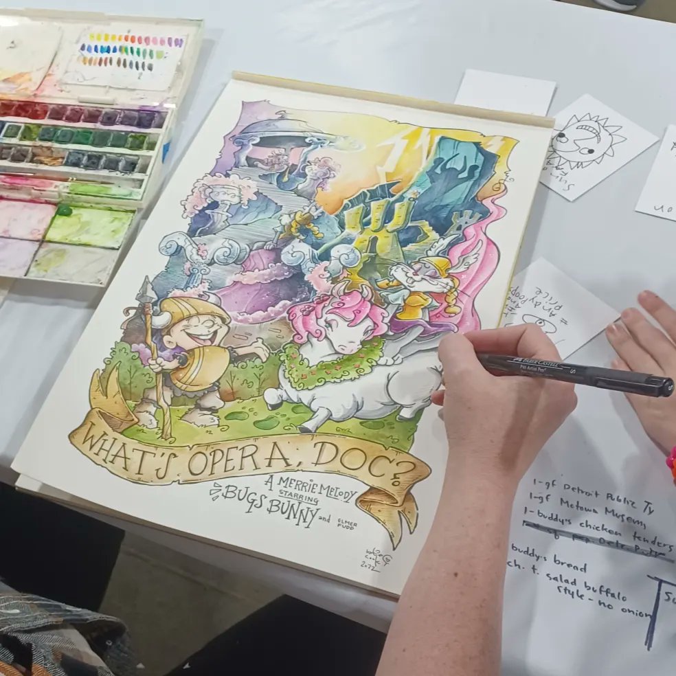 BrianEArts's tweet photo. Always cool when you have a good table neighbor like @katiecandraw! Toasting to success and watching 👀 her work on the next masterpiece #KillTheRabbit and her daughter Harper drew me some original art 🎨! https://t.co/MYiH65jfi8