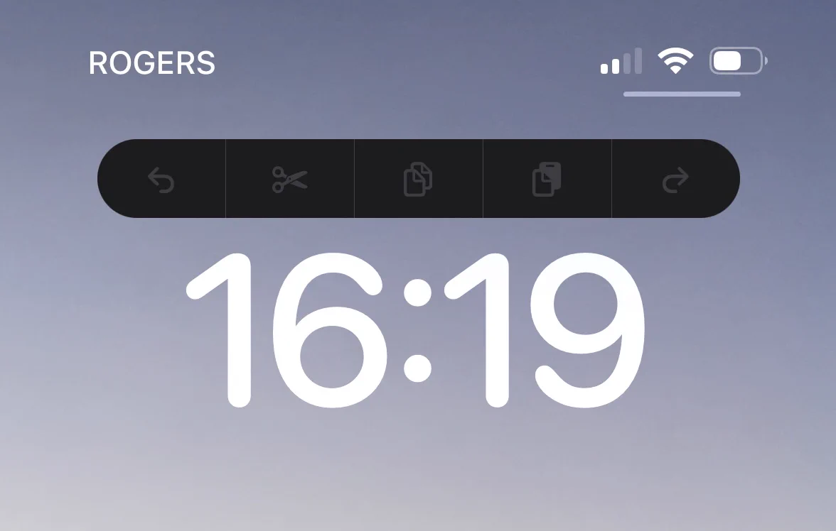 Above my Lock Screen clock is a bar with disabled icons for undo, cut, copy, paste, and redo. 