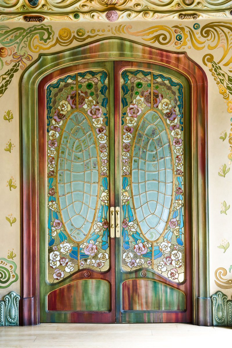 Admiring this set of doors at the Casa Comalat, a private house in the Eixample neighborhood of Barcelona, designed in 1911 by the young modernist architect Salvador Valeri i Pupurull