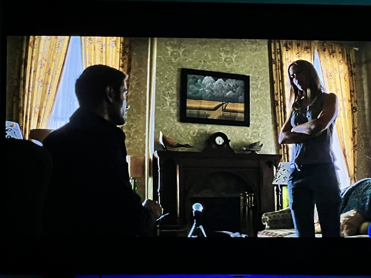 <a href="/rianjohnson/">Rian Johnson</a> I rewatched Looper this week and noticed “Gray and Gold” by John Rogers Cox in the background of the farm house. Obviously, the visuals of the image look similar to country road in the movie. Any other insights you can share behind this piece as an inspiration?