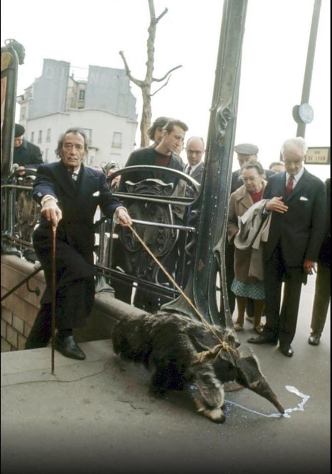 Salvador Dali walking his ant eater in Paris