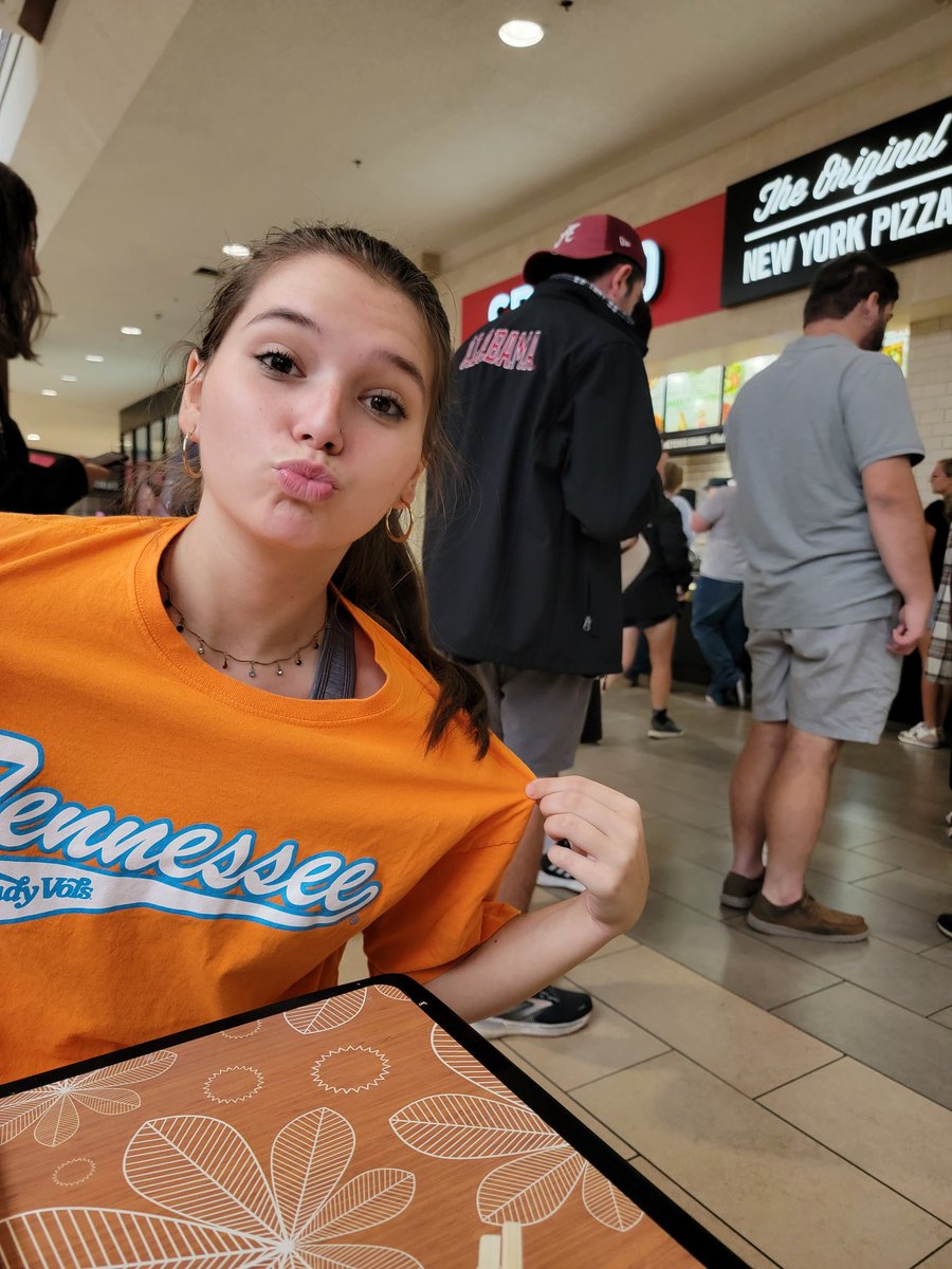kimmies13's tweet photo. We are sitting in the at Hamilton Place Mall. A ton of AL fans are here - students,band members, &amp; families. A man comes up &amp; dares my daughter, JoElna, to sing Rocky Top. Not only does she sing it. She stood on the table!!! And... it continued all the way home. 
#GBO #VFL #VOLS https://t.co/sQCrGq2zFw