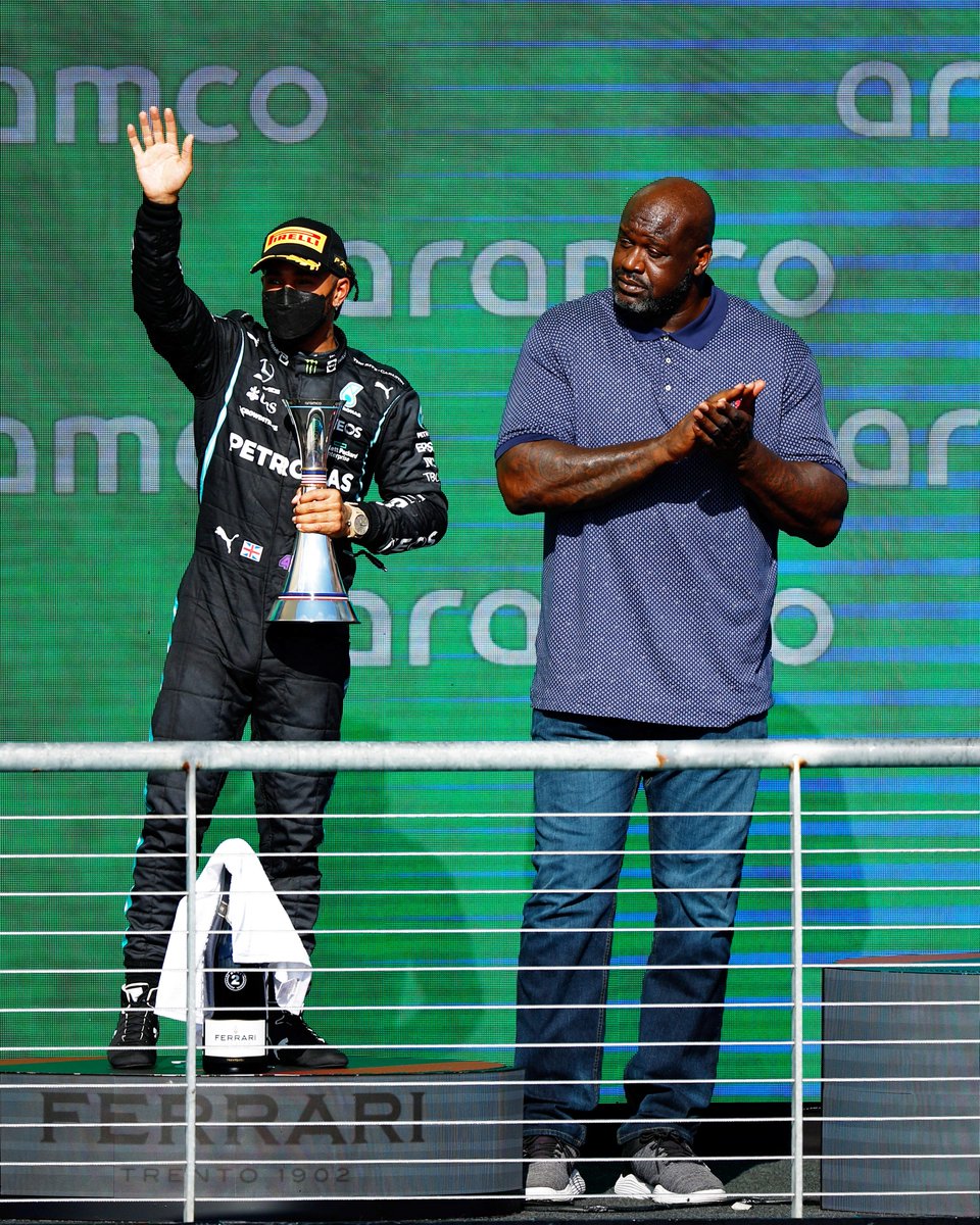 ESPNF1's tweet photo. Throwback to when they decided to let Shaq stand next to Lewis on the podium in Austin 😅 https://t.co/JhYapVRl72