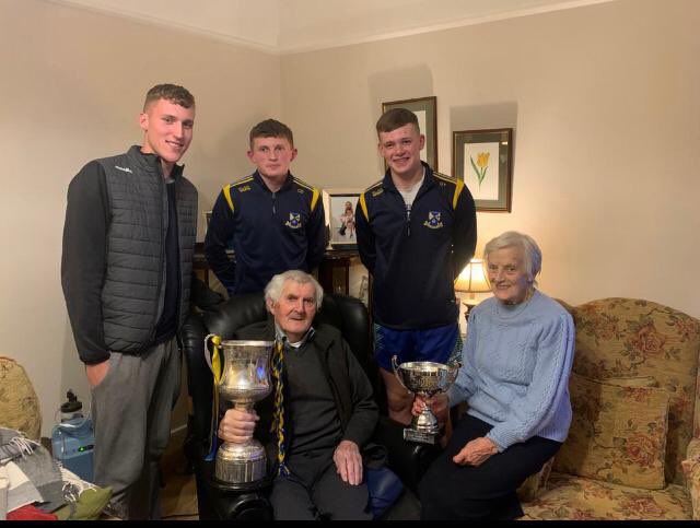 RaheensGAA's tweet photo. Minor captains Fionn Cooke and Gavin Thompson along with Conor Dunne (grandson) visited Jimmy and Mary Dunne tonight with the Gilligan Cup. Brilliant to see. https://t.co/NcSTzCtqQG
