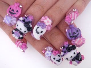 cupcakesanrio's tweet photo. hello kitty halloween nails <3 https://t.co/R32Zu5w1YB