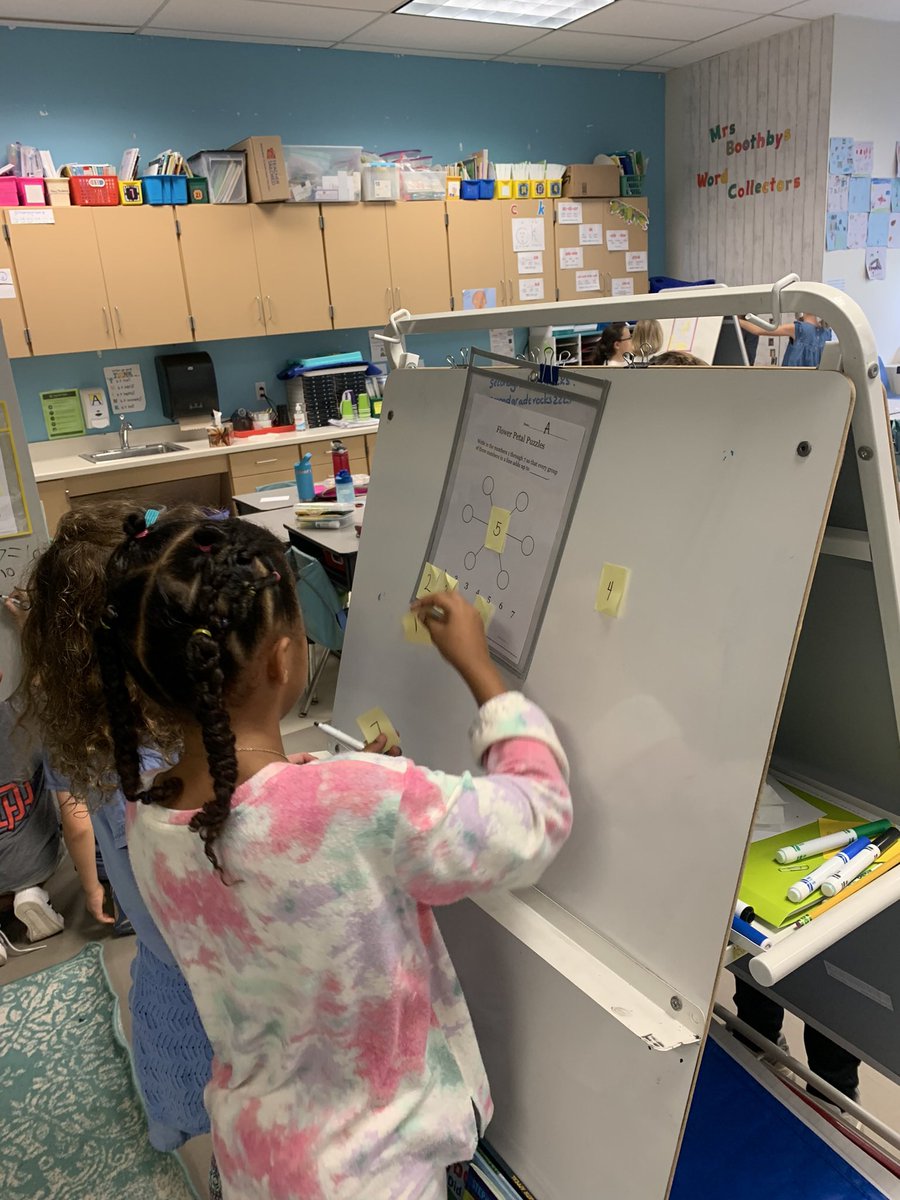 BoothbySuzanne's tweet photo. #buildingthinkingclassrooms with #PBJpartners,  flower petal #thinkingboards and target numbers of 10, 12, 14. There were no #hogsorlogs as they worked together to solve their problems and proud smiles say it all! Another one tomorrow! @APSMath @Ashlawneagles https://t.co/QshAvBYO6O