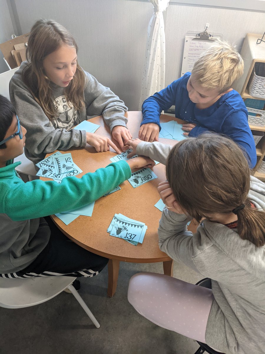 MissSeaman's tweet photo. Comparing decimals with a game of decimal war. Great hands on game to help us practice our new math skills! #ocsbmath @AngelsOCSB https://t.co/P9hiMcV2v4