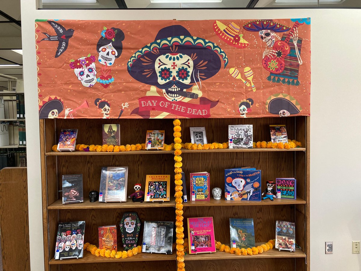 gustavuslibrary's tweet photo. This spooky October, check out our Día de Muertos / Day of the Dead display for a collection of books, picture books, and movies about this Mexican holiday, then head over to our Halloween display for a horror-ible display of more entertainment to make you laugh and scream. https://t.co/iqzflHlHeA
