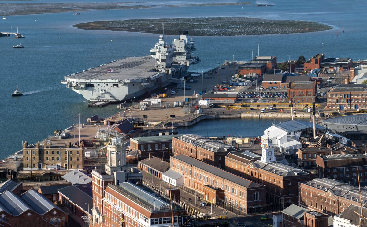 Aerial view <a href="/PHDockyard/">Portsmouth Historic Dockyard</a> showing not only <a href="/HMSPWLS/">HMS Prince of Wales</a> (HMS Prince of Wales), but also #HMSVictory as it heads into it's ~250-year refit.

Shot from @SpinnakerTower