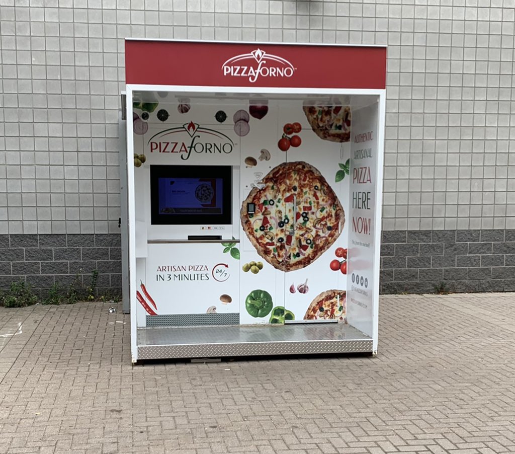 CoinlordCrypto's tweet photo. Auto pizza on campus.  Curious but skeptical.  Is there a little Italian chef inside or just a juke box of frozen pizzas.  Dare I try?  #food #pizza #technology #automation https://t.co/035F7DA4Ak