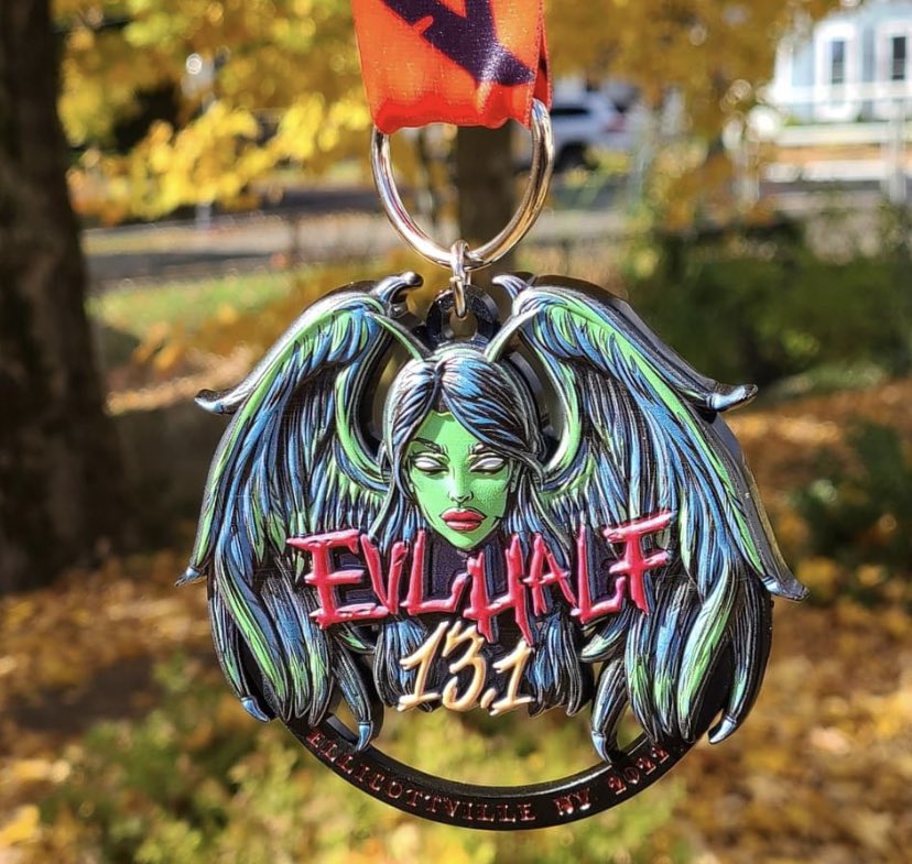 AJBloom2pnt0's tweet photo. It just occurred to me that my third and final half of the year is a few days away and I still don’t have a costume picked out to run in. Up hill. For 13.1 miles. I can’t wait to call this medal my own and add it to my collection. #evlhalf #halfmarathon #halloween https://t.co/fzRRP1f6To